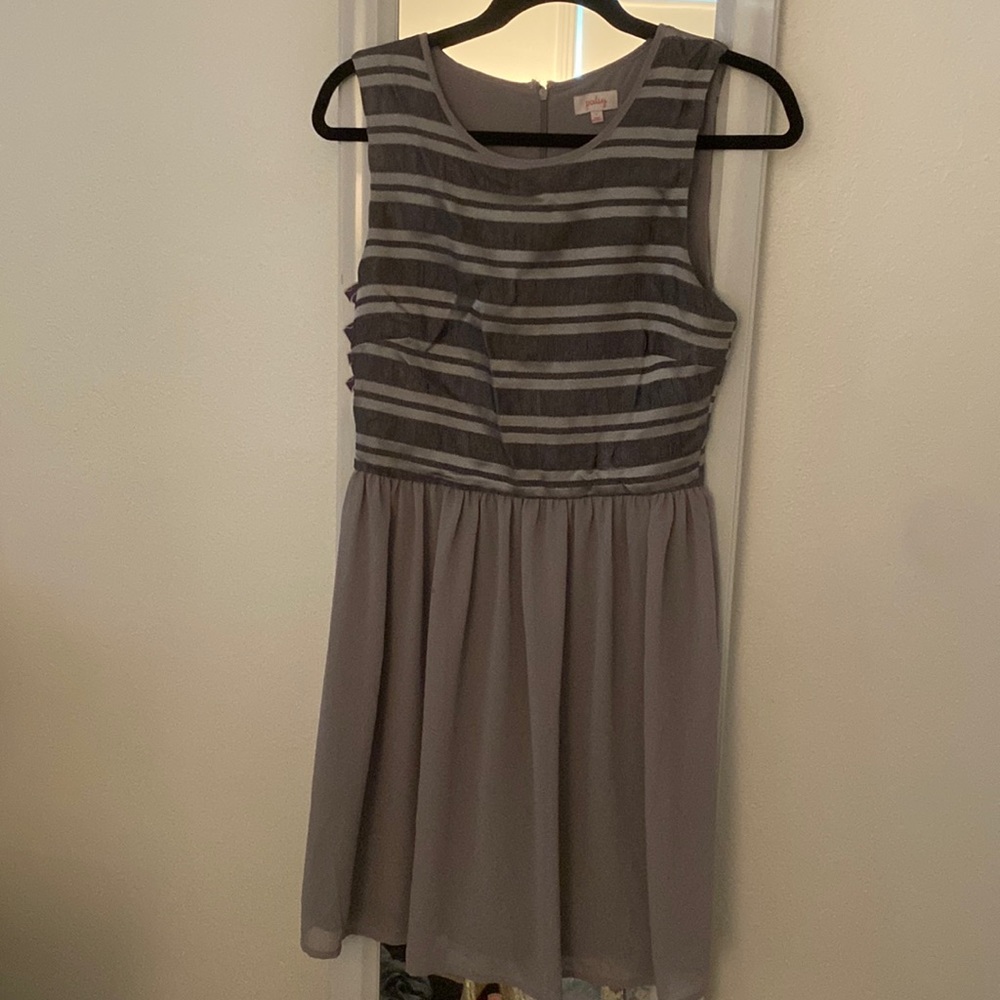 Grey cocktail dress, with textured top. Size Small but fits more like a medium.